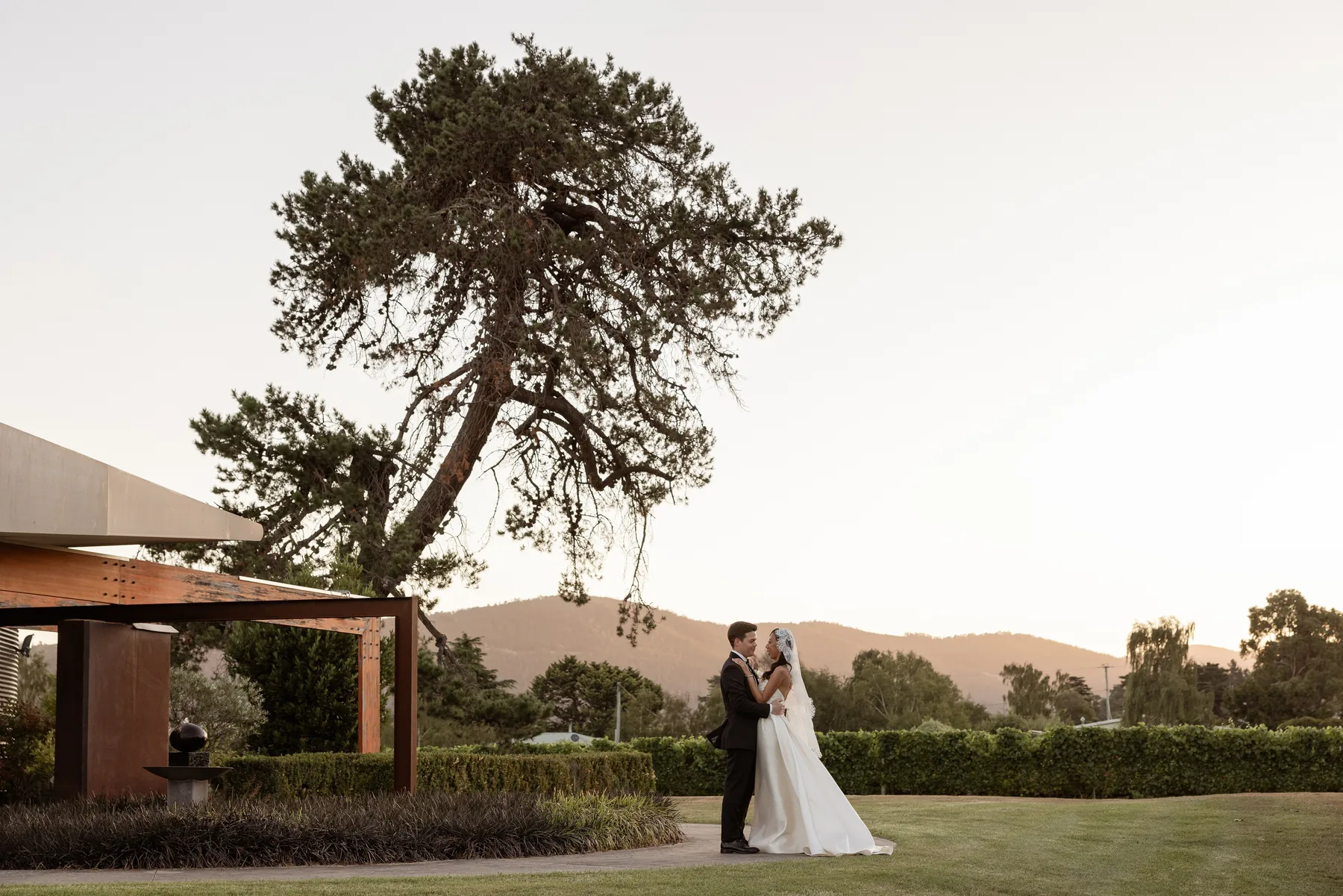 Bride and groom photographed in a landscape wedding setting