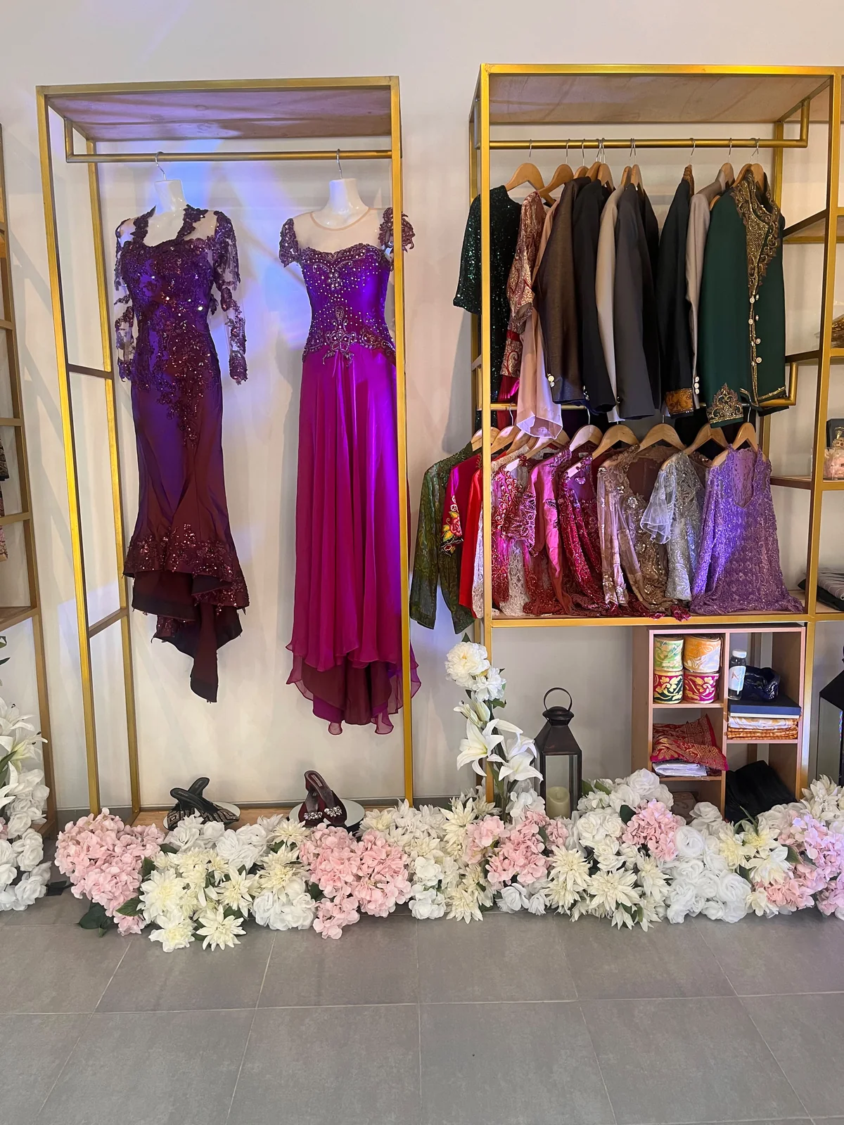Purple and gold garments, jackets, and floral details displayed at OSA